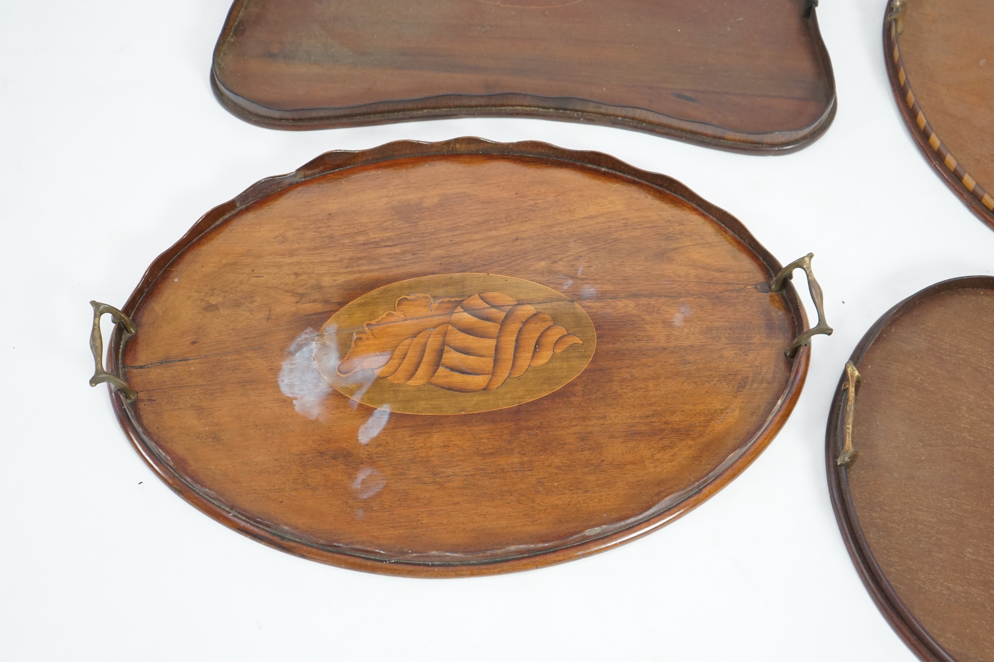 Four Edwardian inlaid mahogany gallery trays